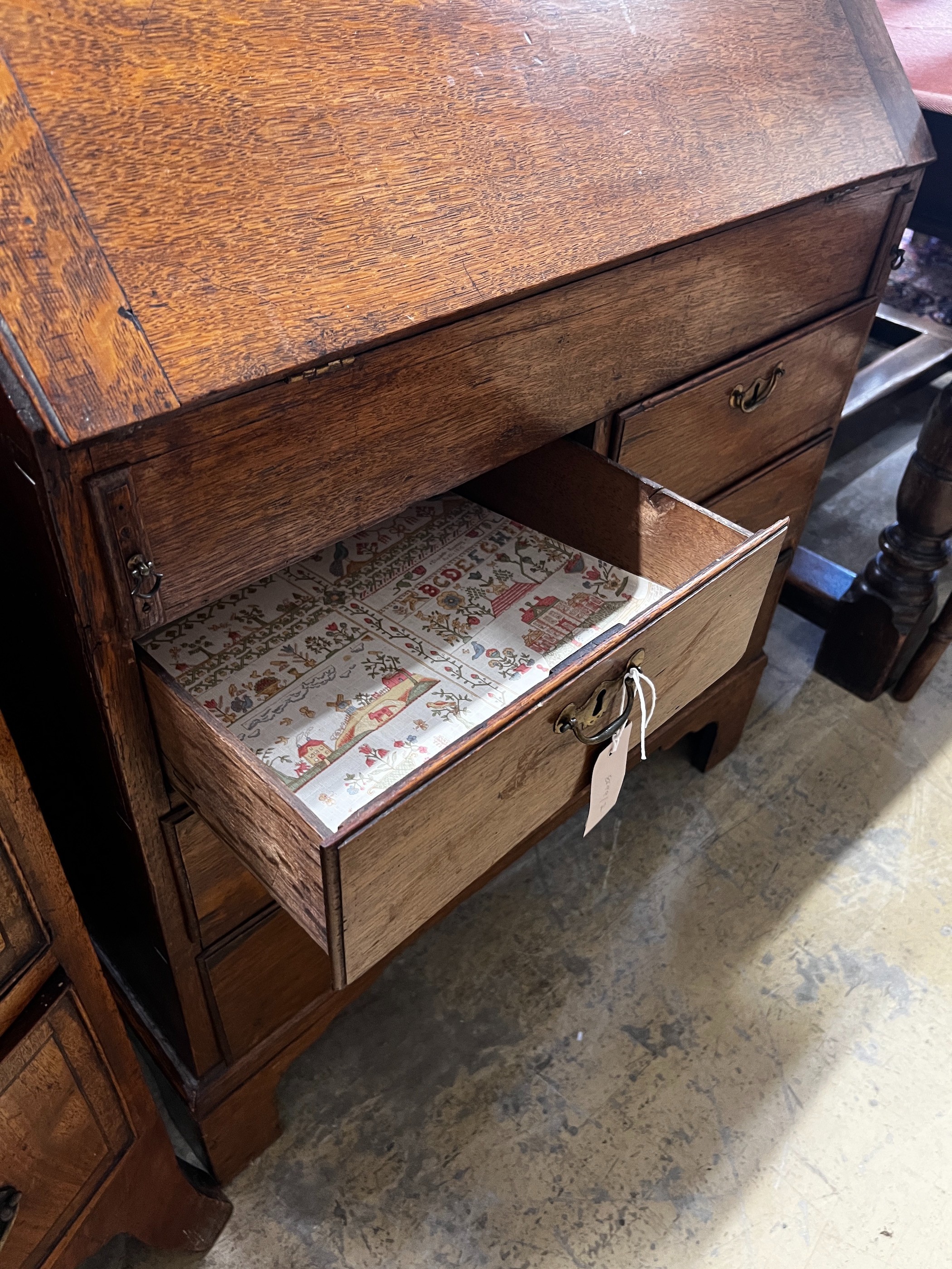 A small 18th century oak bureau, width 76cm, depth 40cm, height 94cm